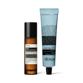 A pump bottle of Solais Replenishing Hand Serum and a tube of Reverence Aromatique Hand Balm together