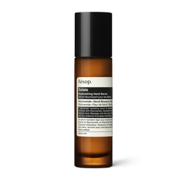 Solais Replenishing Hand Serum in a glass bottle.