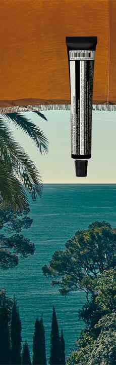 A black skincare tube floating in front of a window overlooking a sunny coastal landscape with
        palm trees and the sea.